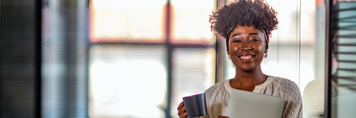 Woman smiling with coffee